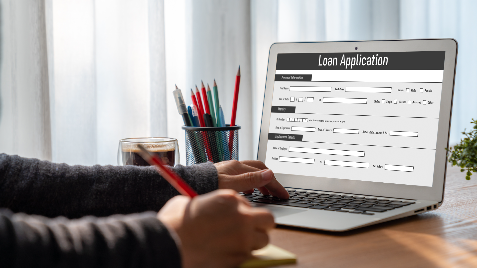 Someone filling out a loan application online.