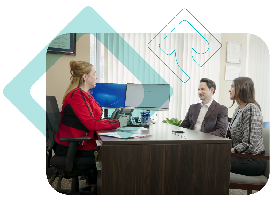 Branded Screen Shot Mario's Commercial-01 Mario Gibson, Financial Advisor with Osaic at Rave Financial talking to two clients in her office