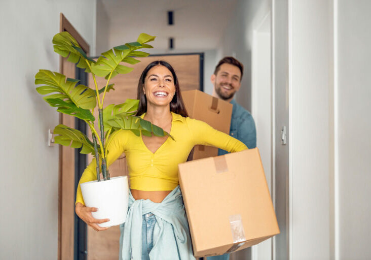 Young couple moving in new home